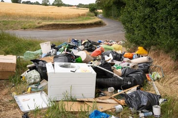 Fly-tipped rubbish on a country lane in England