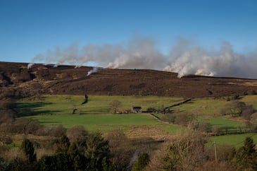Controlled burning on moorland in the countryside