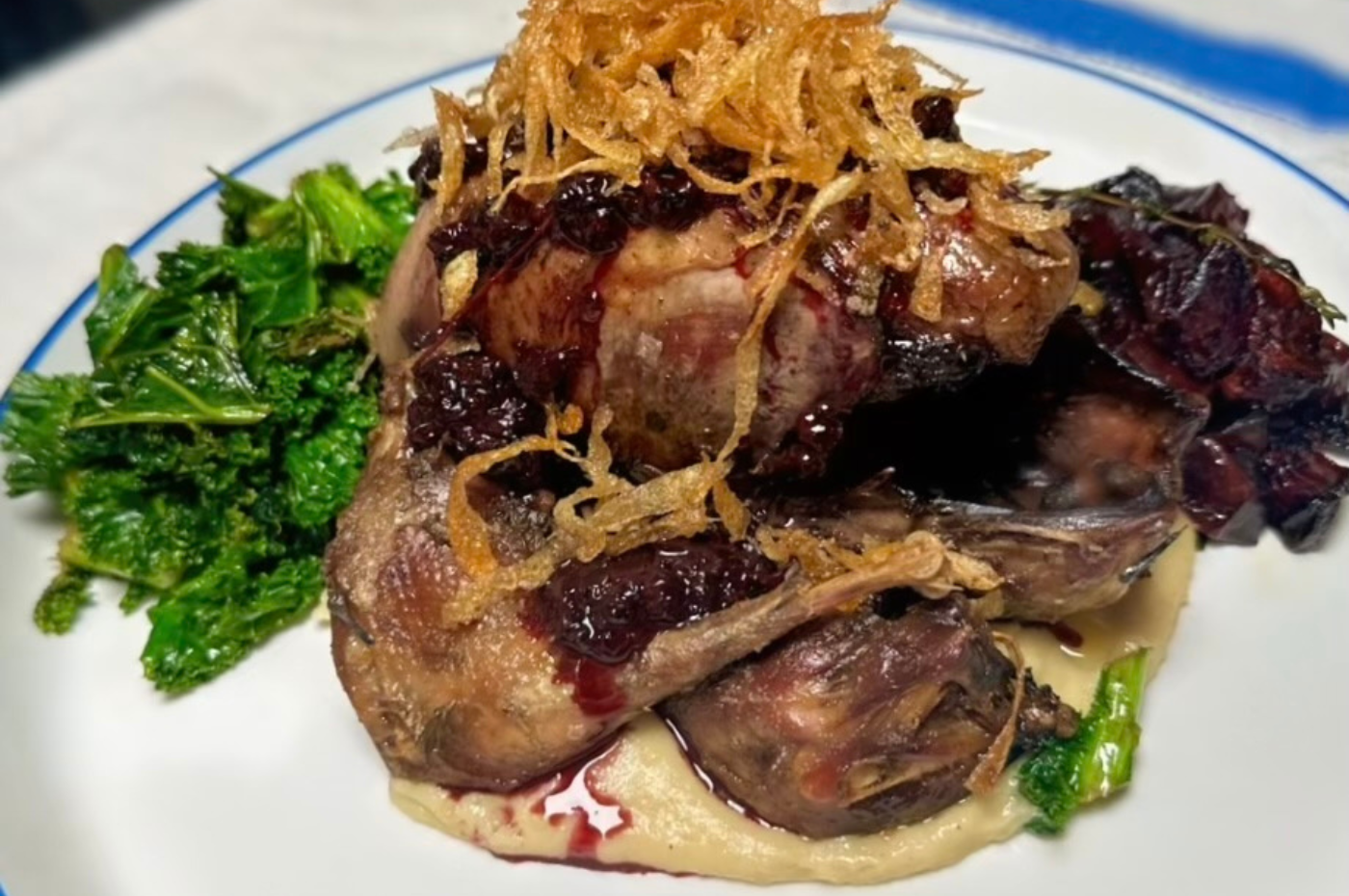 Grouse with blackberry jus, game chips and seasonal vegetables